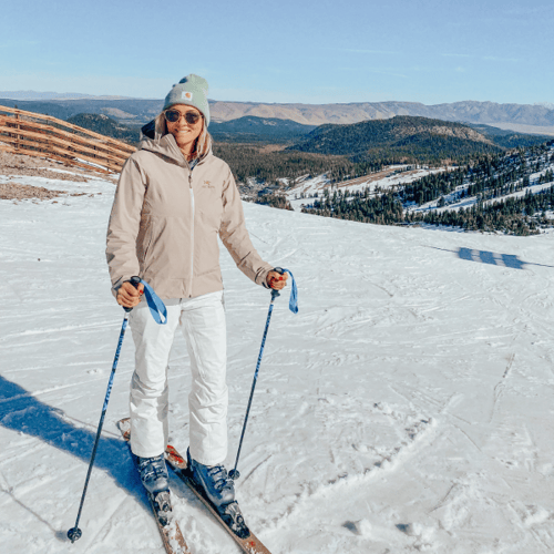 Woman skiing on a snow-covered mountain slope