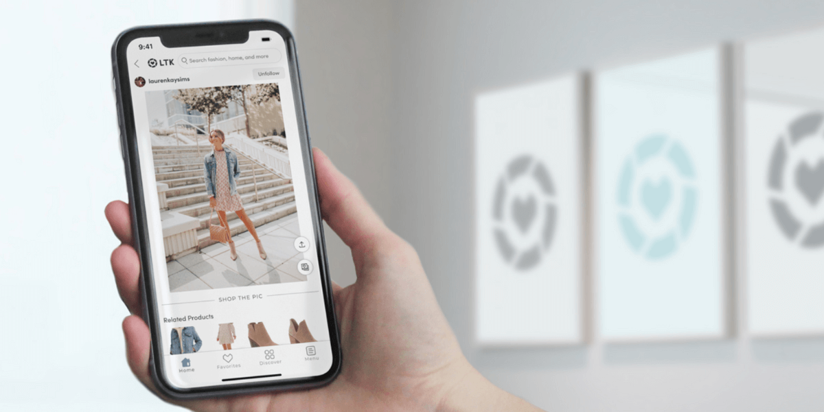 Hand holding phone that's displaying a creator profile on the LTK app