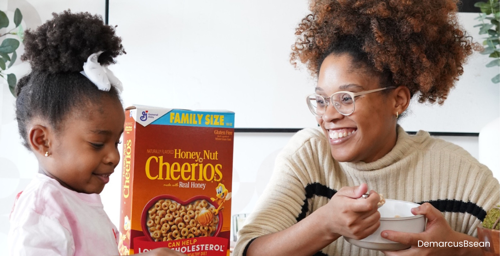 Mother with daughter eating Cheerios