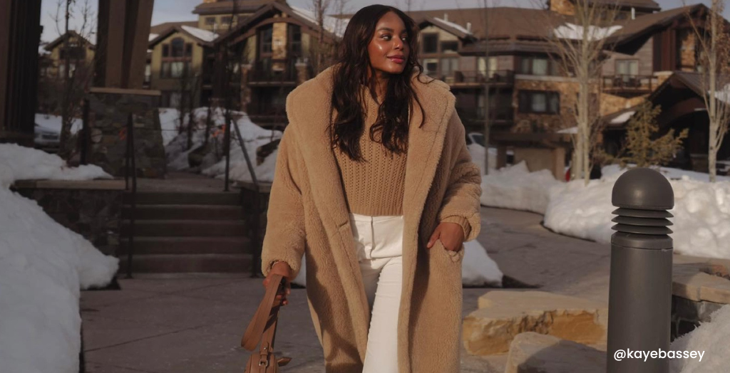 Creator @kayebassey taking a walk around a resort in the snow.