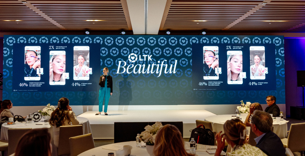 LTK Beautiful event photo with presenter on stage